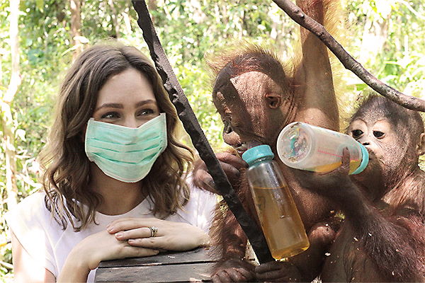 Zoe Foster Blake with baby orangutans