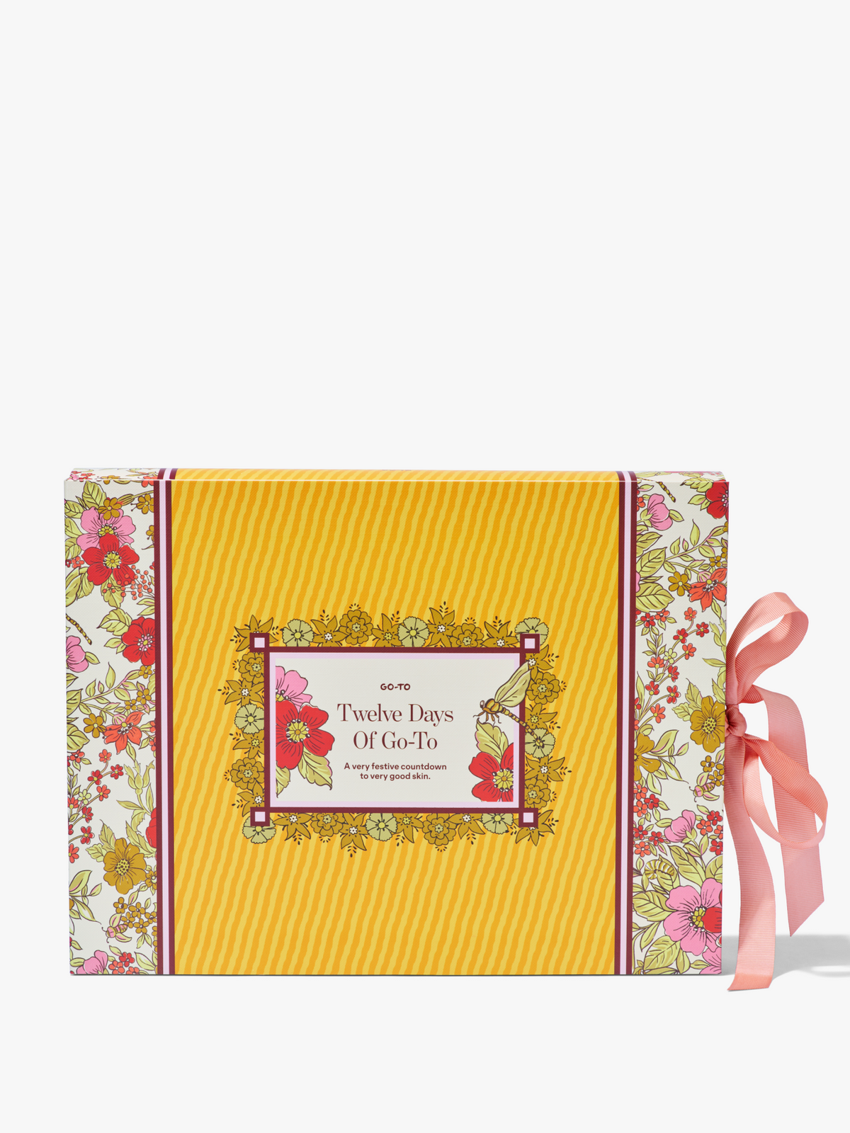 Go To Skincare Twelve Days Of Go To advent calendar in a yellow striped floral box with a pink ribbon and festive illustrated label