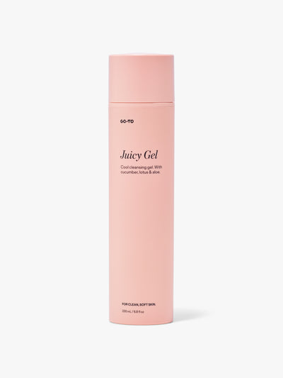 Pink bottle of Go-To Juicy Gel, a cleansing gel with cucumber, lotus, and aloe, for clean, soft skin. 200 mL size.