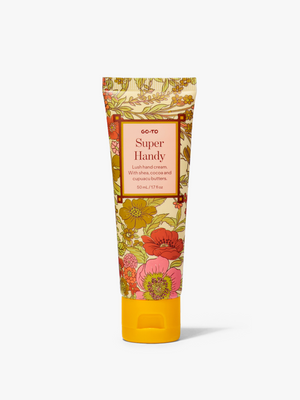 Go-To Skincare Super Handy hand cream in a bright floral tube with a yellow cap shown against a white background